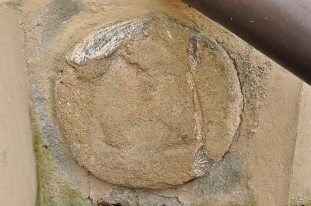 Jesenice, Podbořánky - Pohanský kámen ve zdi kostela